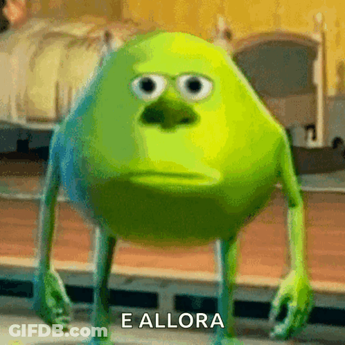 Mike Wazowski From Monsters Inc Has A Sad Look On His Face And The Words E Allora Are Below Him GIF