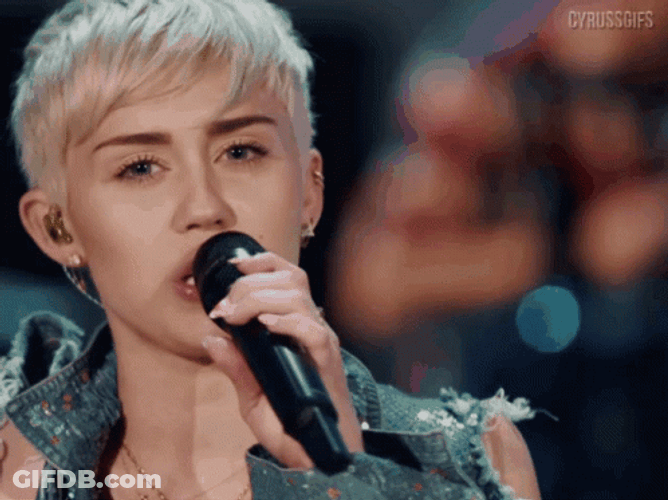 Miley Cyrus Pointing While Singing GIF