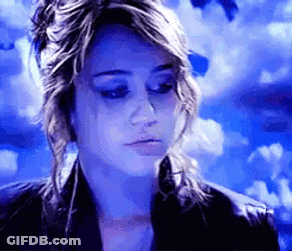 Miley Cyrus Throwing Rose Flower GIF