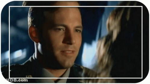 Military Man Looking At Woman In Frame GIF