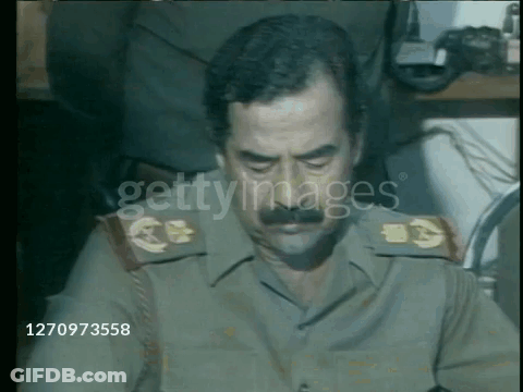 Military Man With Mustache In Front Of Getty Image GIF