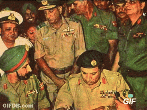 Military Men Gathered Around Man In Black Beret Saying GIF