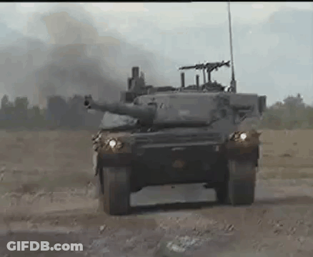 Military Tank Driving Down Dirt Road GIF