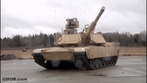 Military Tank Driving On Road With Trees GIF