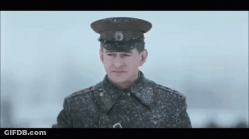 Military Uniform Man Looking At Camera Snow GIF