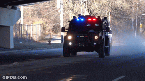Military Vehicle With Law Enforcement License Plate GIF