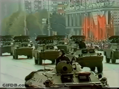 Military Vehicles Driving In Parade GIF