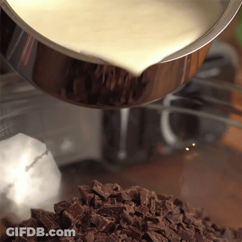 Milk Is Being Poured Into A Bowl Of Chocolate GIF