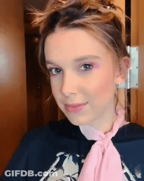 Millie Bobby Brown Wearing Pink Scarf GIF