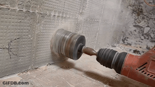 Milwaukee Brand Drill Drilling Into Wall GIF