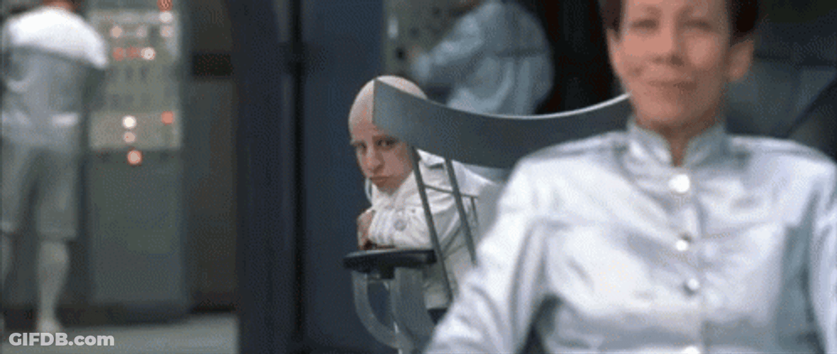Mini Me Looking Back GIF