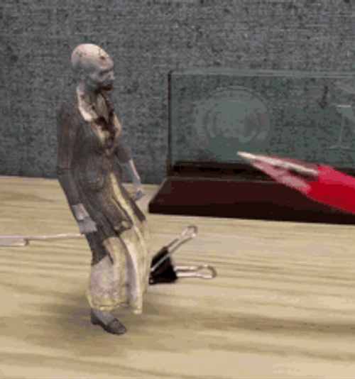 Miniature Attacking Zombie GIF