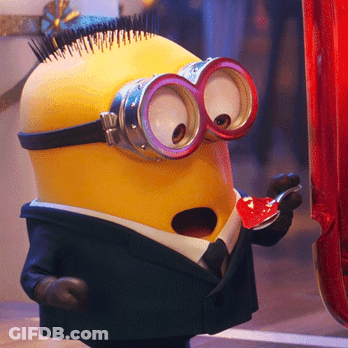 Minion In Suit Holding Spoon GIF