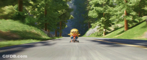 Minion Riding Tricycle In Woods GIF