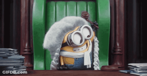 Minion Wearing Wig Goggles Sitting With Gavel In Front Of Green Door GIF