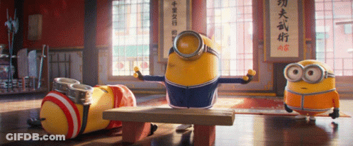 Minions In Room With Chinese Writing On Wall GIF