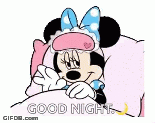 Minnie Mouse Is Laying In A Bed Wearing A Sleep Mask And Saying Good Night . GIF