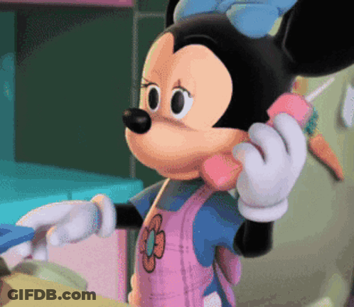 Minnie Mouse Is Talking On A Pink Phone With A Flower On Her Apron GIF