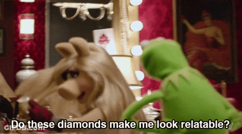 Miss Piggy And Kermit The Frog In Front Of Mirror Saying Do These Diamonds Make Me Look Relatable GIF