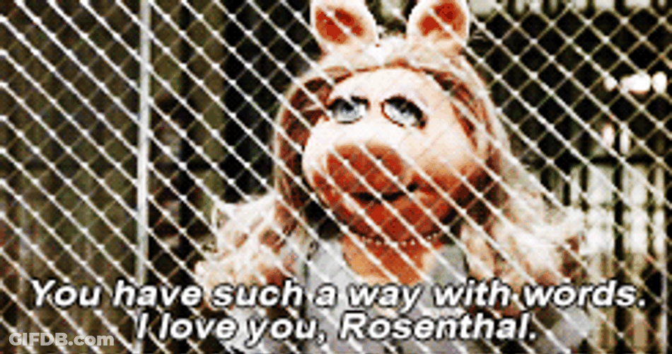 Miss Piggy Behind Fence GIF