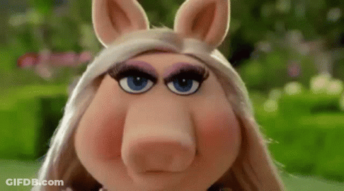 Miss Piggy From The Muppet Show Is Making A Funny Face With Her Eyes Closed . GIF