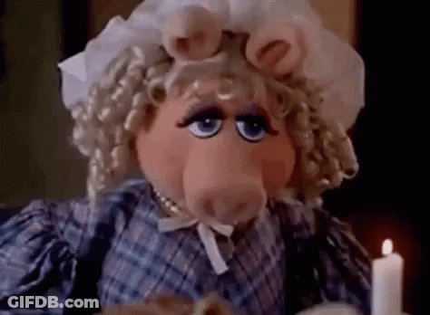Miss Piggy Sitting At Table With Candle GIF