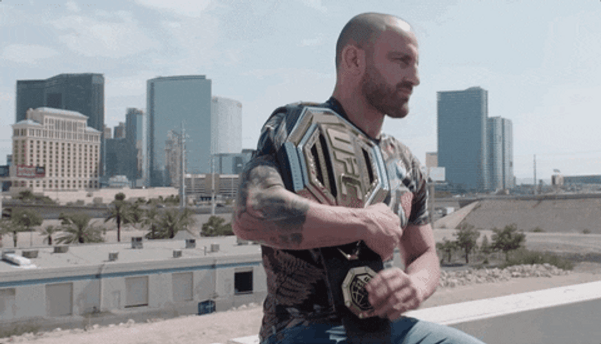 Mix Martial Artist Cédric Doumbé Showing Belt GIF