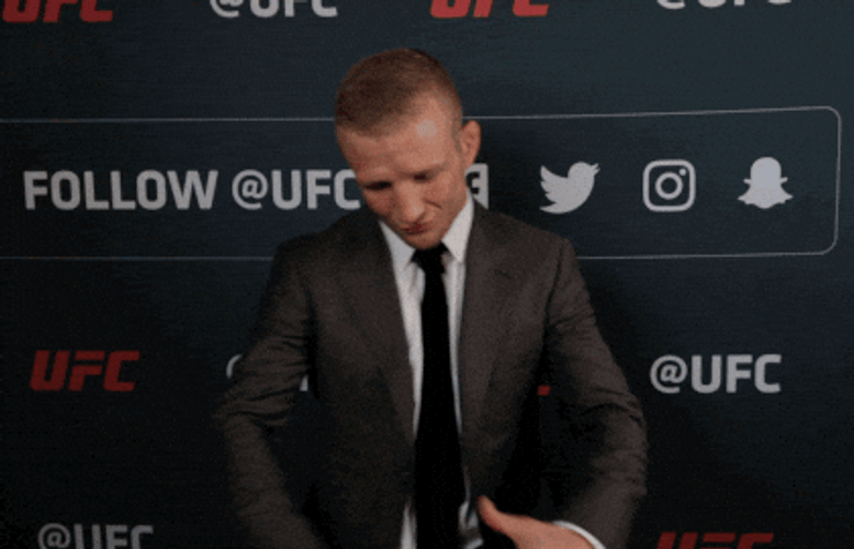 Mixed Martial Artist TJ Dillashaw Signaling Wearing Belt GIF