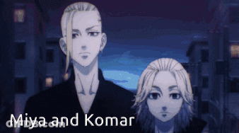 Miya And Komar Are Standing Next To Each Other GIF