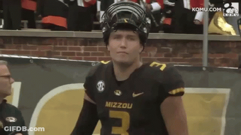 Mizzou Football Player In Helmet By Brick Wall GIF