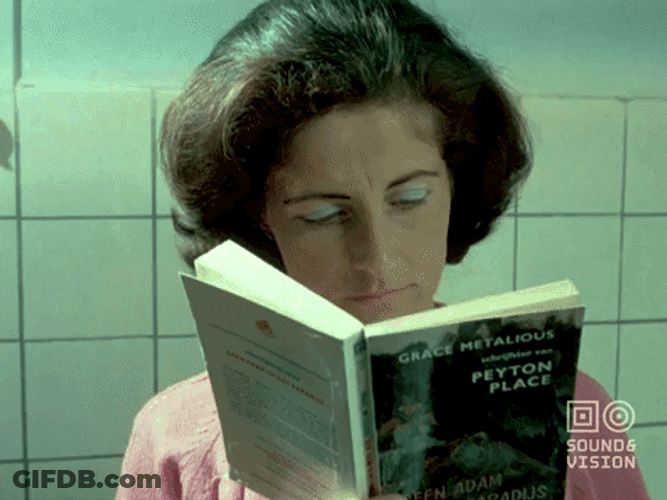 Mom Multitasking Reading And Cooking GIF