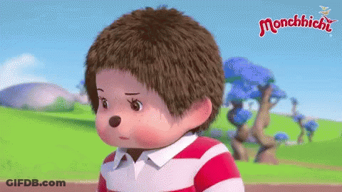 Monchhichi Doll Standing In Field With Striped Shirt GIF