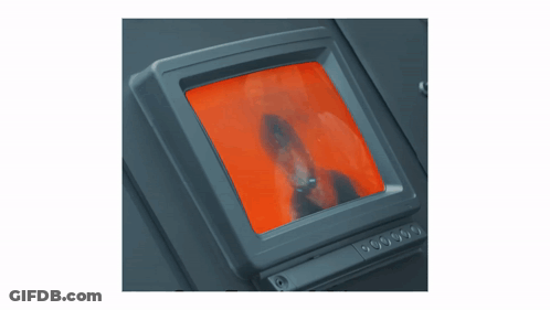 Monitor With Red Screen Showing Man's Face GIF