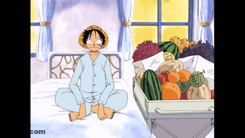 Monkey D Luffy Sitting On Bed Next To Box Of Fruit GIF