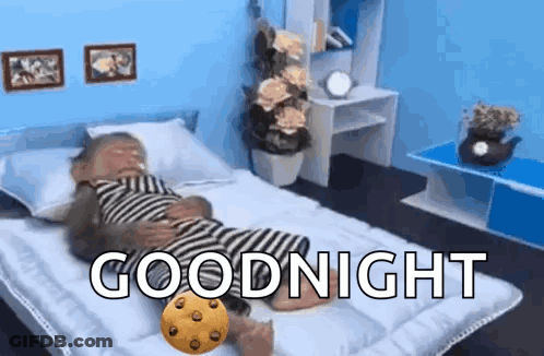 Monkey Laying On Bed With Cookie Saying Goodnight GIF