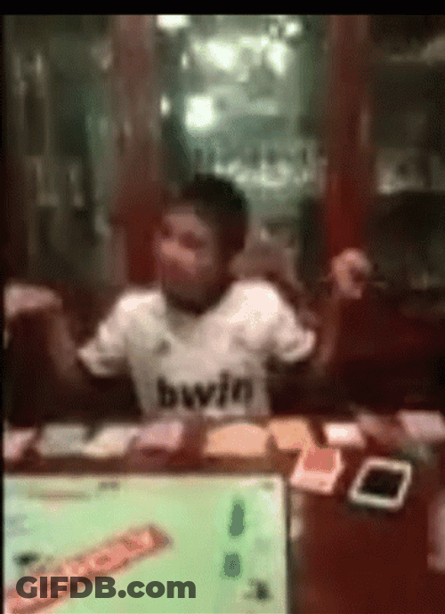 Monopoly Money In Front Of Young Boy GIF