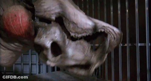 Monster Face In Cage With Bars GIF