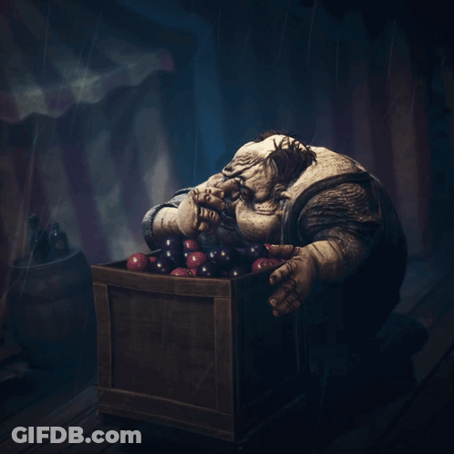 Monster Sitting In Box Of Fruit GIF