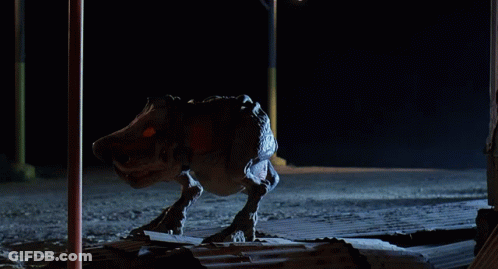 Monster Statue With Letter T On Face GIF