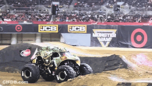 Monster Truck Driving Down Dirt Track At JCB Monster Jam GIF