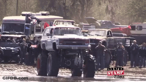 Monster Truck Driving Through Mud With Mud Stamp Films GIF