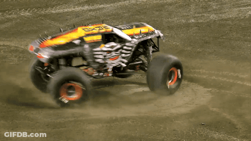 Monster Truck With Skull Driving On Dirt Road GIF