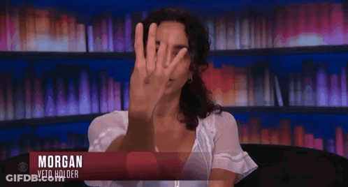Morgan Veto Holder Sitting On Couch Hands Up GIF