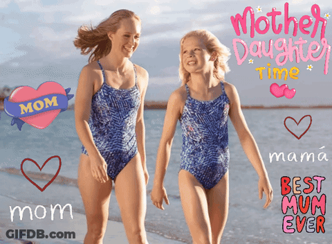 Mother And Daughter Walking On Beach GIF