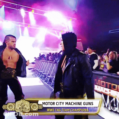Motor City Machine Guns WWE Tag Team Champions Are Shown On A Screen GIF