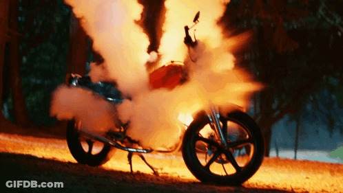 Motorcycle On Fire With Smoke From Wheel GIF