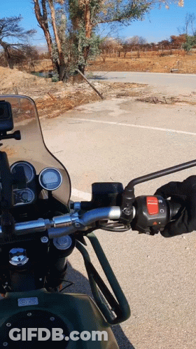 Motorcycle Parked On Road With Cycle World GIF