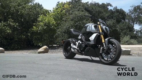 Motorcycle Parked On Road With Cycle World GIF