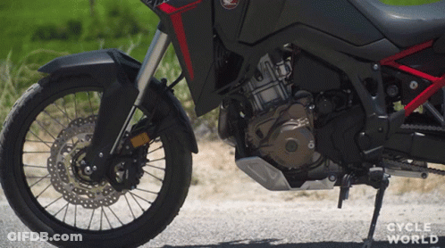 Motorcycle Parked On Road With Cycle World GIF