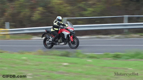 Motorcyclist Riding Red Motorcycle GIF